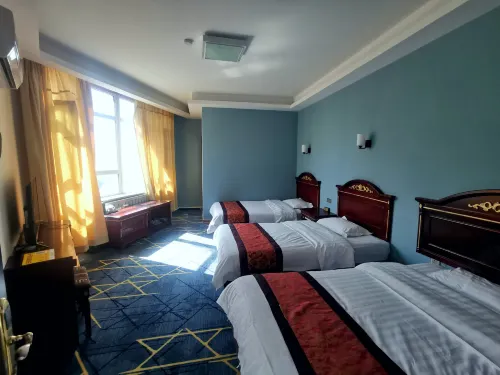 Haba River Xinya Business Hotel - Inns
