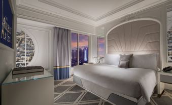 a spacious living room with comfortable seating and a fully equipped kitchenette at The Parisian Macao