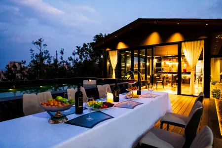 Herald Of Autumn Homestay Отели рядом с достопримечательностью «Honghe Nativeland»