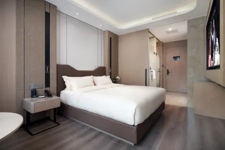PALACE HOTELS(Tianjin Binhai New Area Tanggu High Speed Railway Station) Отели рядом с достопримечательностью «Taida Financial Plaza E3AB»
