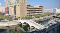 Shell Hotel (Fei County Dongfang Shopping Plaza Ginkgo Jin Street)