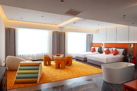 Xingguang Huayuan Hotel (Ordos Municipal Government) Отели рядом с достопримечательностью «Kangbashi Ulanmulun Lake Music Fountain»