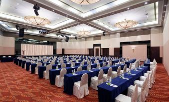 a ballroom with tables and chairs arranged for an event at Eastin Hotel Kuala Lumpur