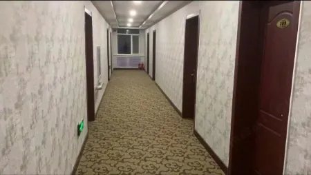 Xinyi Business Hotel Отели в г. Чжоулу