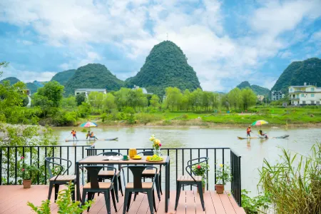 Yangshuo Shanhelian Riverside Garden Hotel Отели рядом с достопримечательностью «Yulong Bridge»