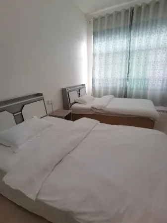 Luodian Daxiao Well Yuanhong Hotel Отели в г. Лодян