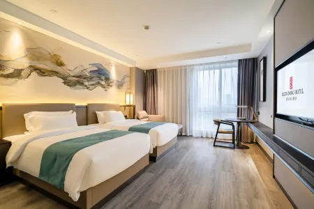 Rezen Dong Hotel (Huzhou City Center High-speed Railway Station Store) Отели в г. Хучжоу