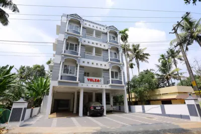 Yelza Hotel and Residence Hotels near Santhigiri Ashram