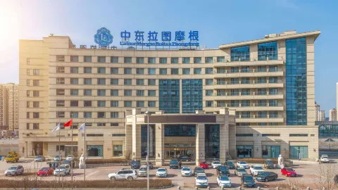 Zhongdong Latour Morgan Hotel (Zhongdong New World Shopping Park) in Тунхуа