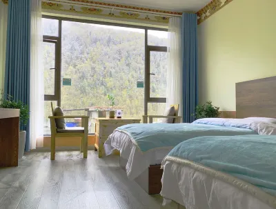Four Sisters Mountain Knapsack International Hostel Отели рядом с достопримечательностью «Changpingcun»