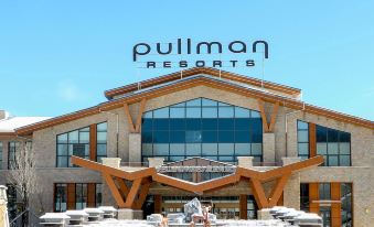 "a large building with a sign that reads "" pullman resorts "" prominently displayed on the front" at Pullman Changbaishan Resort