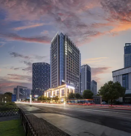 Manju Hotel (Zhuji Wanfeng Xintiandi Yongli Plaza) Отели в г. Чжуцзи