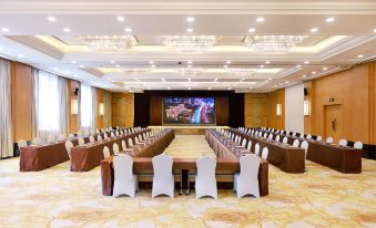 a ballroom with tables and chairs arranged for an event at Yan An Hotel
