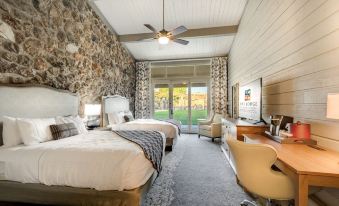 a room with two beds , one on the left side and another on the right side at Lodge of Four Seasons Golf Resort, Marina & Spa