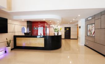 The clean reception desk in the modern hotel lobby is ready for guests to use at Hotel Sogo Fairview