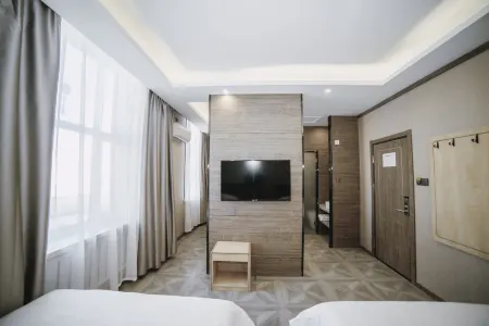 Yijia Hotel (Jixi Wanda) Отели в г. Цзидун