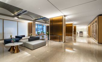 A modern apartment features large windows and an open concept living room connected to the main area at Rezen Select Hotel Guangzhou Baiyun International Airport (Terminal T2 Branch)