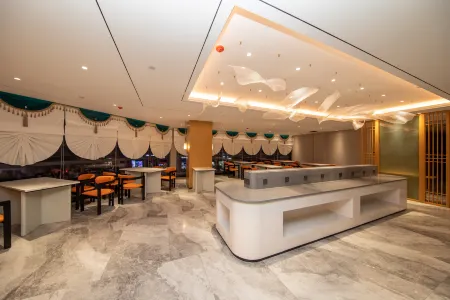 Shuangjiang Chaxiang Hotel Отели рядом с достопримечательностью «White Elephant Temple»