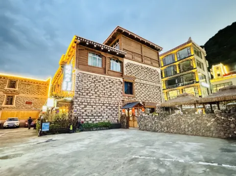 Mingcai Hotel (Siguniangshan Scenic Area)