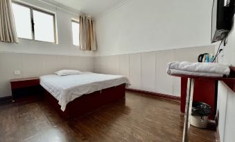 Zhoukou Kaixinyuan Hotel (Baicheng Railway Station)