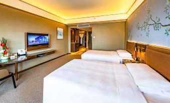 a hotel room with two beds , a flat - screen tv , and a walk - in closet , all decorated in white at Millennium Harbourview Hotel Xiamen