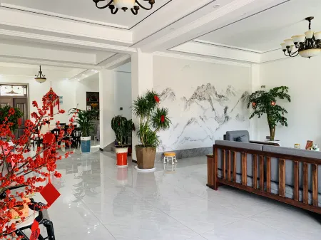 Sunshine Xincheng Homestay Отели рядом с достопримечательностью «Mulan Grassland»