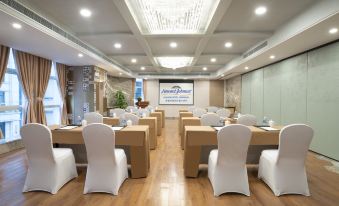 The ballroom is arranged with tables and chairs for a large event at Howard Johnson Huaihai Hotel Shanghai