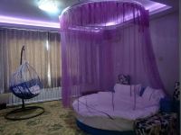 玛纳斯爱诺风情主题宾馆 - 紫色梦幻圆床房