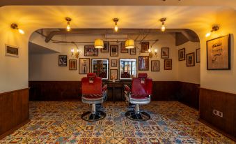 A room decorated like an old-fashioned hair salon with plenty of chairs in the front at James Joyce Coffetel Hotel (Guangzhou Beijing Road Metro Station Pedestrian Street)