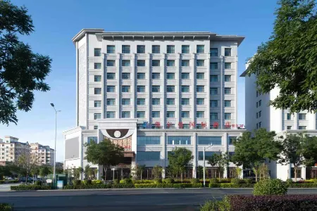 Kai'erman International Hotel Отели рядом с достопримечательностью «Xijiao Park»