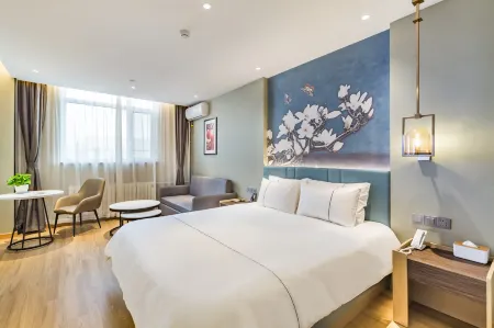 Ai Fei Hotel (Yantai University Yingchun Street) Отели рядом с достопримечательностью «Wenjing College Yantai University»