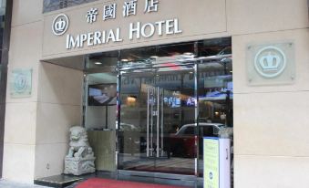 The entrance to a store is marked by an oriental sign above its glass door at Imperial Hotel