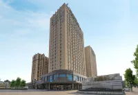 Dexin Henglong International Hotel Отели рядом с достопримечательностью «Huale Gymnasium»