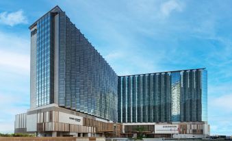 A rendering depicts the exterior and facade of an art deco style hotel in Hong Kong at Four Points by Sheraton Hong Kong Tung Chung