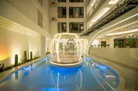Aitingbao Hot Spring Hotel (Xishuangbanna jinghongGaozhuang Xishuangjing Xingguang Night Market) - 4-Sterne