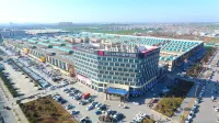 Yishang Hotel (Zhoukou High speed Railway East Station Huayao City Branch) فنادق في جَوكَو