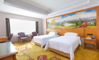 a hotel room with two beds , a large painting on the wall , and purple chairs at Vienna Hotels