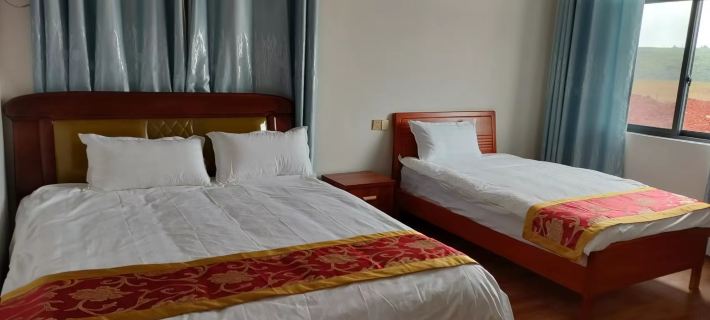 Xingang Inn Fenglong Bay Hotéis em Condado de Xundian Hui e Yi