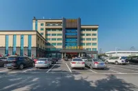 Tianzhong International Inn Hotel berhampiran Lapangan Terbang Xinyang Minggang