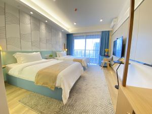 Yipin Xiaozhu Apartment (Jiangmen High-speed Railway Station Wanda Branch)