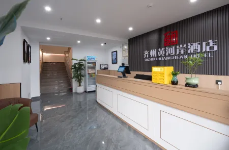 Qizhou Huanghe'an Hotel (Quancheng Oulebao) Отели в г. Цихэсянь