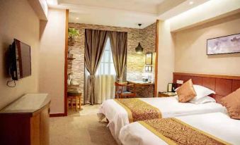 a hotel room with two beds , a window , and a desk , all decorated in neutral colors at Rome Hotel