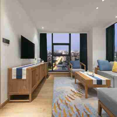 仟那酒店(鶴壁高鐵站淇河景觀店) Rooms