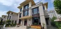 Gloria Plaza Hotel Qingdao Отели в г. Циндао