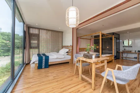 Huangchuan Zhuyun Xuju Hot Spring Homestay Отели рядом с достопримечательностью «Nanshan Bulao Valley Scenic Area»