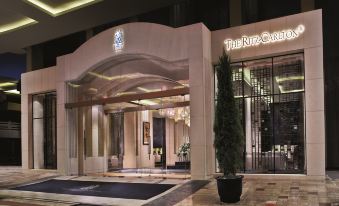 In the night, a hotel lobby with a grand entrance to an art deco style building at The Portman Ritz-Carlton, Shanghai