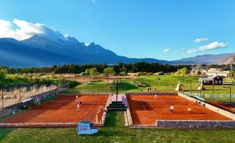 Thousands of Mountains Veiled in Evening Snow • Golden Rays Gilding the Peaks | Panoramic View Hotel