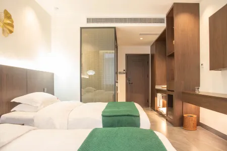 Tongxing Tea House Hotel, Mengla Отели в г. Менла