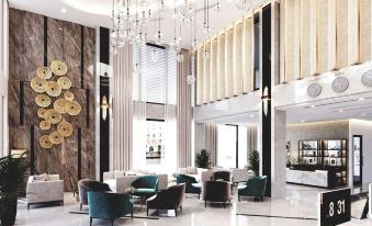 a luxurious hotel lobby with white marble floors , a large chandelier hanging from the ceiling , and various seating arrangements at Purple Lotus Hotel