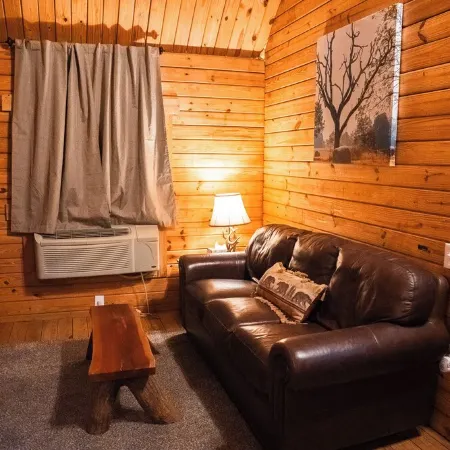 Charming cabin with loft, porch swing, AC, and WiFi on 295-acre peaceful retreat